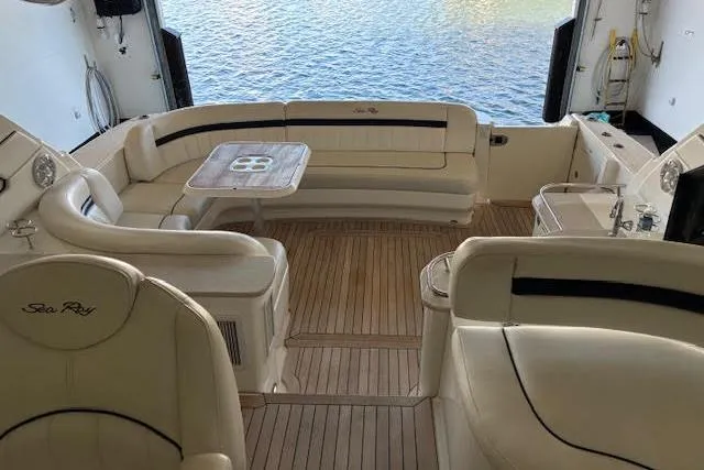Slide: The Image of Luxurious 2008 Sea Ray 48 Sundancer yacht interior with elegant seating and wooden flooring. - 15