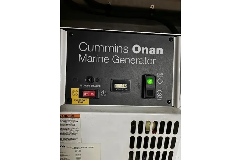 Slide: The Image of Cummins Onan marine generator control panel on 2008 Sea Ray 48 Sundancer. - 17