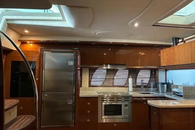 Slide: The Image of Luxurious 2008 Sea Ray 48 Sundancer yacht interior with modern kitchen amenities. - 18