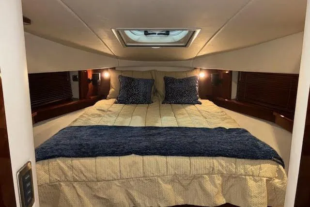 Slide: The Image of Luxurious bedroom interior of 2008 Sea Ray 48 Sundancer yacht with cozy bedding. - 7