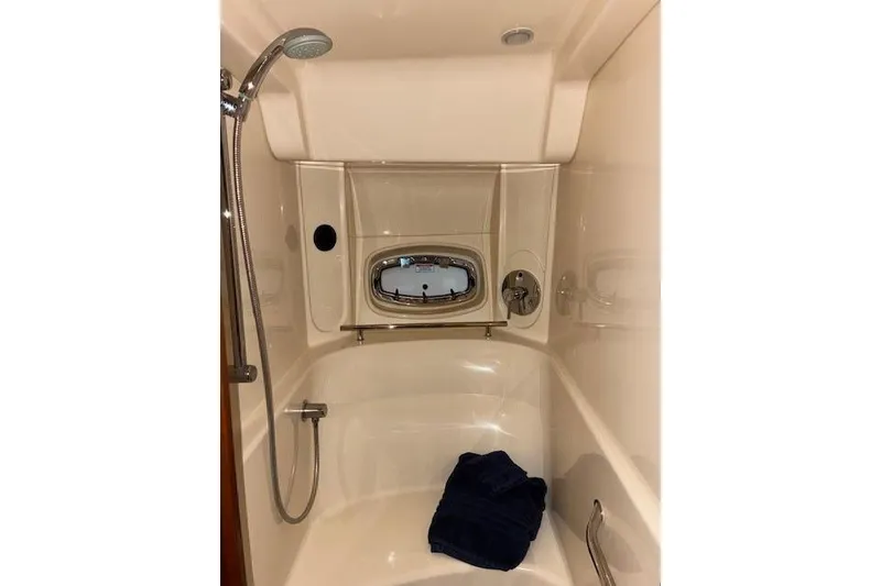 Slide: The Image of Luxurious bathroom in 2008 Sea Ray 48 Sundancer yacht with shower and porthole. - 9