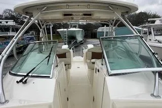 Slide: The Image of 2010 World Cat 290 DC boat with open cockpit and dual windshields. - 14