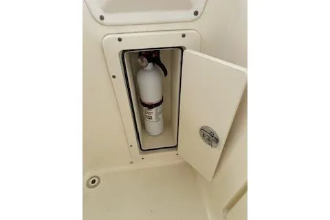 Slide: The Image of Fire extinguisher in compartment of 2010 World Cat 290 DC boat. - 15