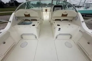 Slide: The Image of 2010 World Cat 290 DC boat interior with dual seating and open deck layout. - 16
