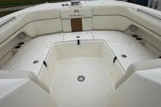 Slide: The Image of 2010 World Cat 290 DC boat interior with spacious seating and clean design. - 17