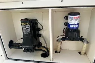 Slide: The Image of 2010 World Cat 290 DC boat compartment with pump and filter system. - 19