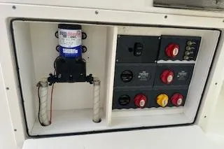 Slide: The Image of Electrical panel and pump system on a 2010 World Cat 290 DC boat. - 20
