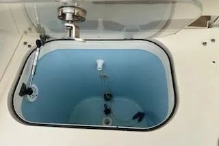 Slide: The Image of Livewell on 2010 World Cat 290 DC boat, open lid, clean interior. - 21