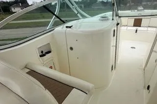 Slide: The Image of 2010 World Cat 290 DC boat interior with seating and helm. - 23