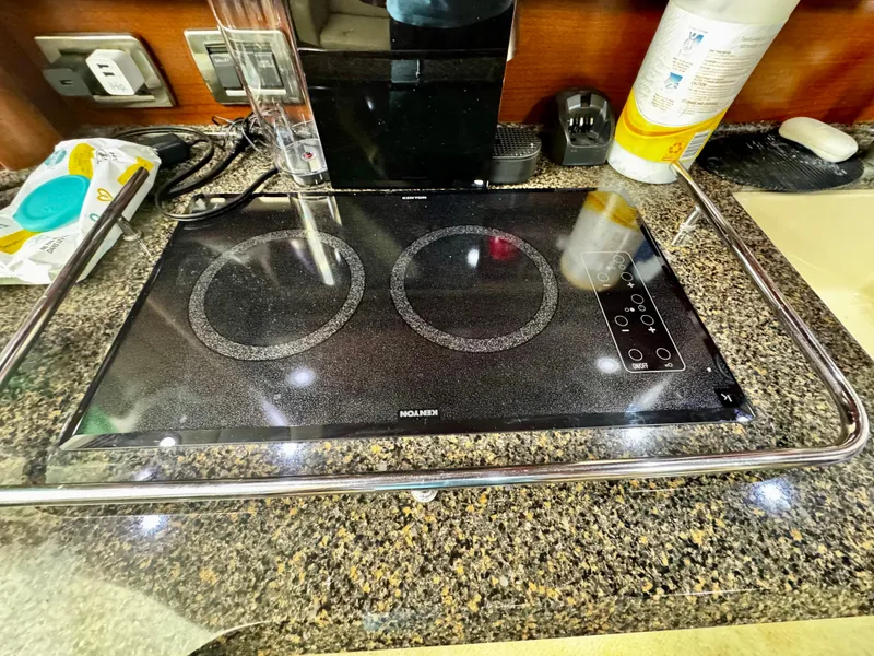 Slide: The Image of Glass cooktop in 2007 Sea Ray 40 Sundancer yacht kitchen, surrounded by granite countertop. - 22