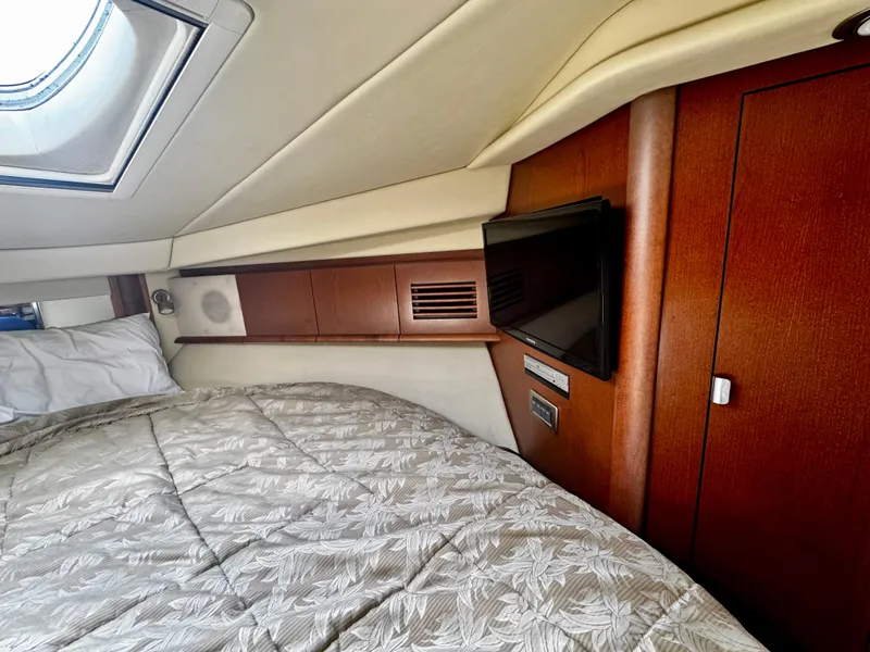 Slide: The Image of Interior cabin of 2007 Sea Ray 40 Sundancer with bed and TV. - 26