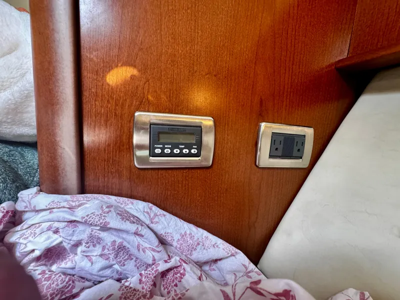 Slide: The Image of Control panel and outlet on 2007 Sea Ray 40 Sundancer yacht interior. - 29