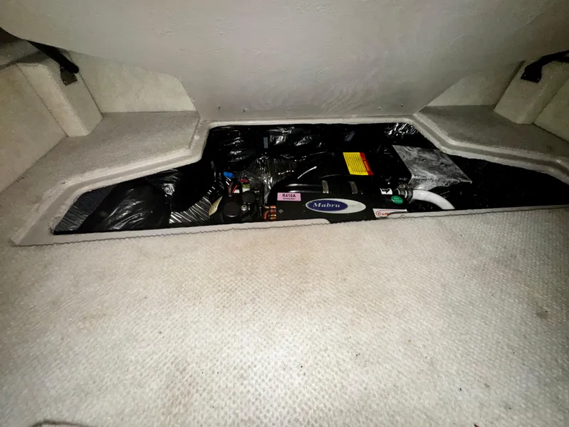 Slide: The Image of 2007 Sea Ray 40 Sundancer engine compartment with visible components and wiring. - 30
