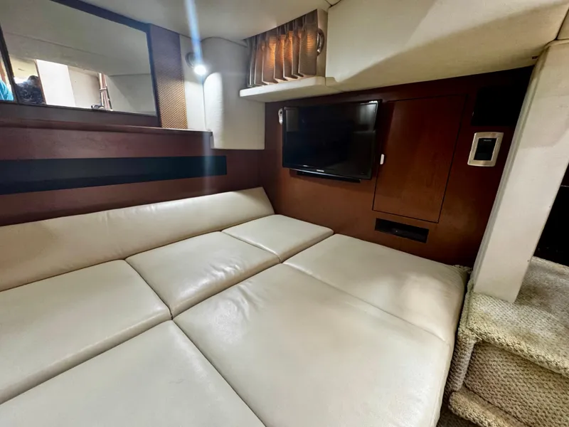 Slide: The Image of Interior of 2007 Sea Ray 40 Sundancer with leather seating and wall-mounted TV. - 31