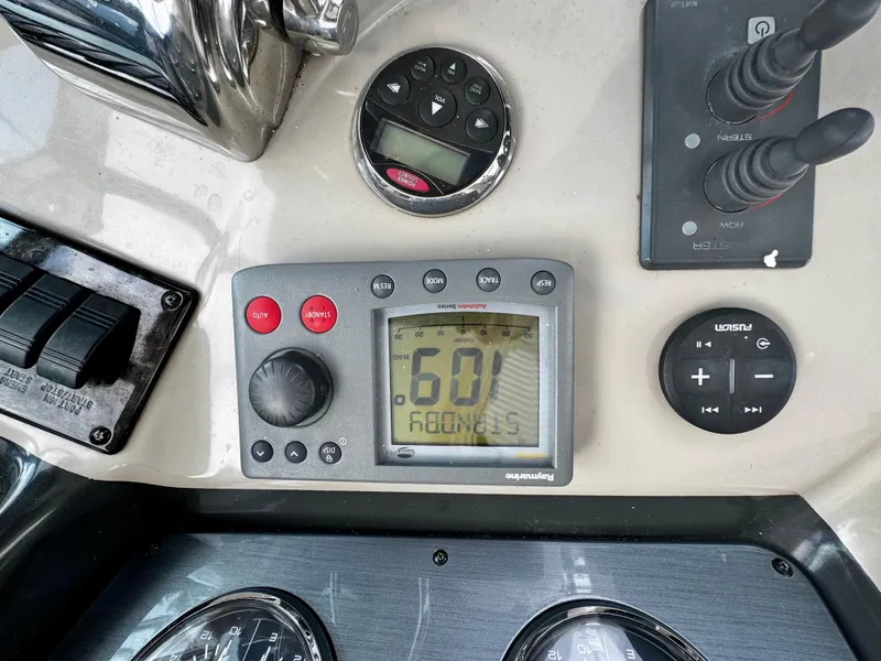 Slide: The Image of Control panel of a 2007 Sea Ray 40 Sundancer boat, featuring navigation instruments. - 40