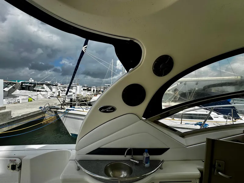 Slide: The Image of 2007 Sea Ray 40 Sundancer interior view at marina, showcasing sleek design and amenities. - 43