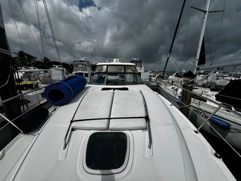 Slide: The Image of 2007 Sea Ray 40 Sundancer yacht docked under cloudy skies. - 46