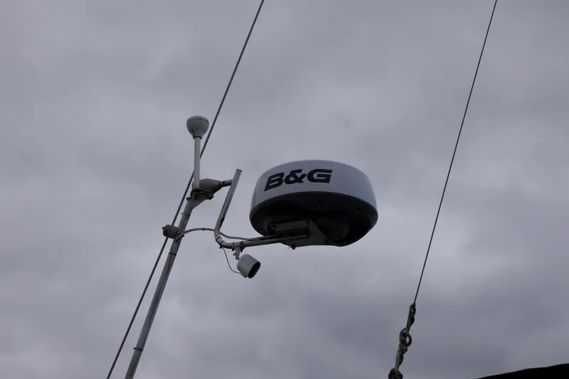Slide: The Image of Radar equipment on a 1989 Catalina 42 sailboat under cloudy skies. - 14