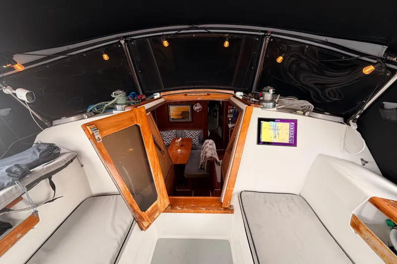 Slide: The Image of Interior view of 1989 Catalina 42 sailboat cockpit with navigation equipment. - 21