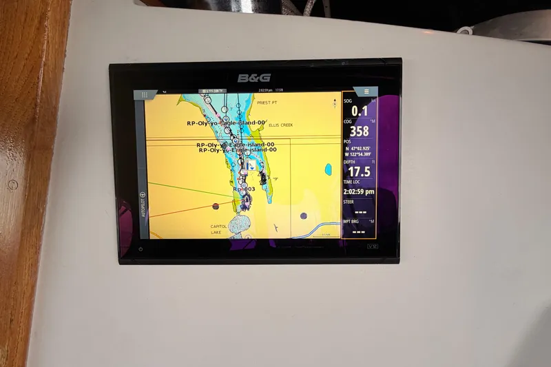 Slide: The Image of Navigation display on a 1989 Catalina 42 sailboat, showing map and sailing data. - 22