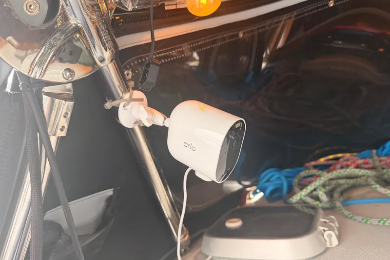 Slide: The Image of Security camera mounted on a 1989 Catalina 42 sailboat, with ropes in the background. - 23