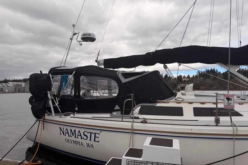 Slide: The Image of 1989 Catalina 42 sailboat "Namaste" docked in Olympia, WA under cloudy skies. - 3
