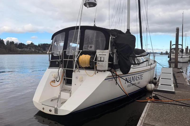Slide: The Image of 1989 Catalina 42 sailboat docked, named "Namaste," in Olympia, WA marina. - 4