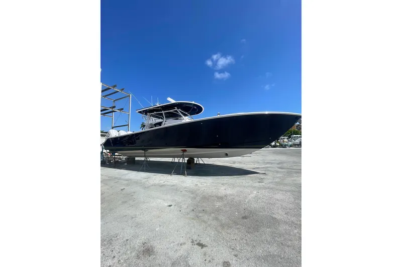 Slide: The Image of 2025 Jupiter 43 boat on dry dock under clear blue sky. - 26