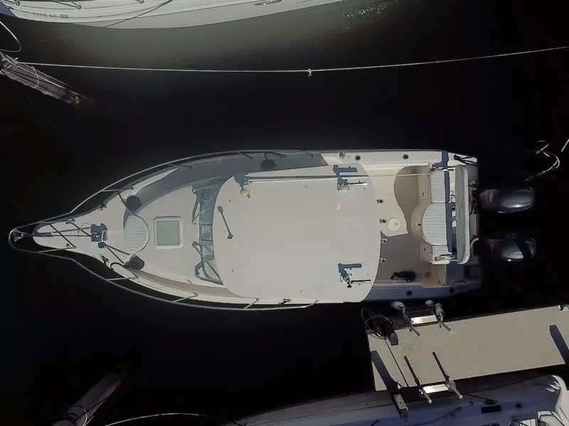 Slide: The Image of Overhead view of a 2006 Cobia 250 Walk-Around boat docked. - 2