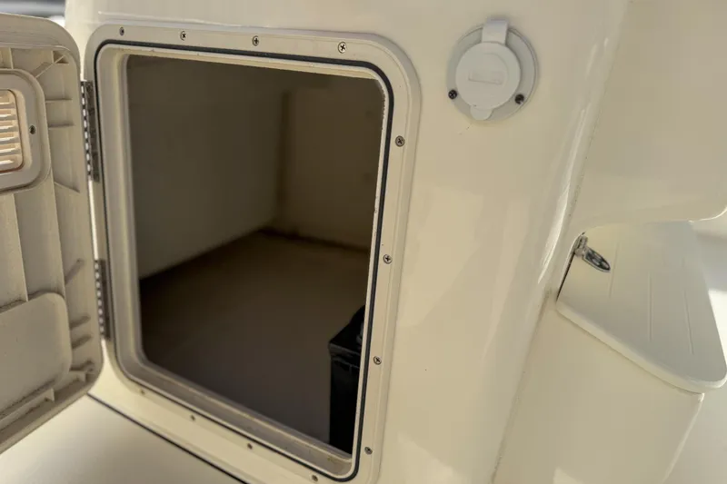 Slide: The Image of Open storage compartment on 2022 Key West 188 Bay Reef boat. - 10