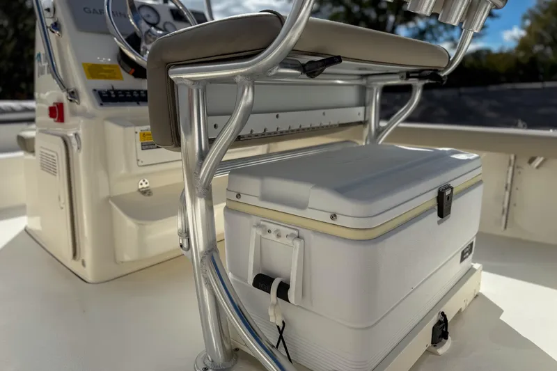 Slide: The Image of 2022 Key West 188 Bay Reef boat interior with cooler and seating. - 11