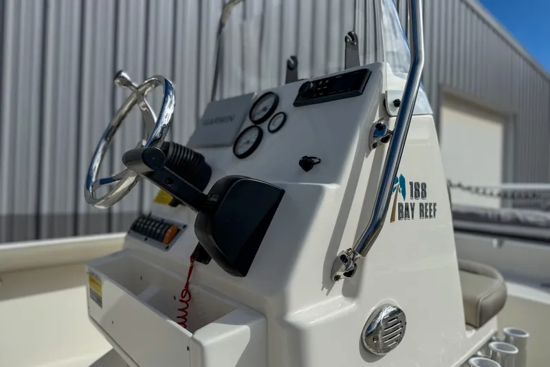 Slide: The Image of 2022 Key West 188 Bay Reef boat console with steering wheel and controls. - 4