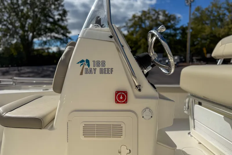 Slide: The Image of 2022 Key West 188 Bay Reef boat console with steering wheel and seating. - 8