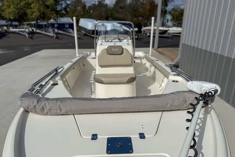 Slide: The Image of 2022 Key West 188 Bay Reef boat, interior view, parked outdoors near a building. - 9