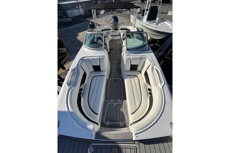 Slide: The Image of 2014 Hurricane SunDeck 2690 OB boat with spacious seating and sleek design. - 10