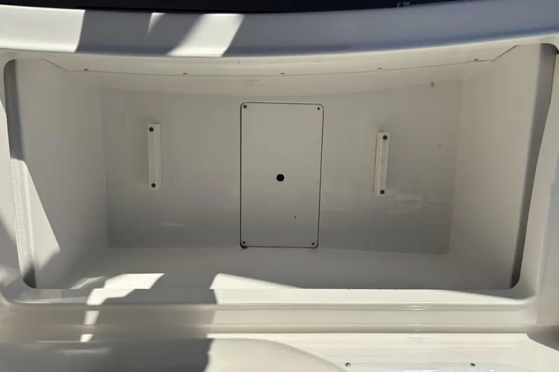 Slide: The Image of Storage compartment of 2014 Hurricane SunDeck 2690 OB boat, featuring a clean, spacious interior. - 14