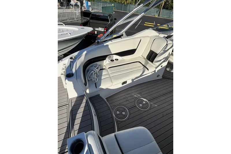 Slide: The Image of 2014 Hurricane SunDeck 2690 OB boat interior with seating and deck details. - 9