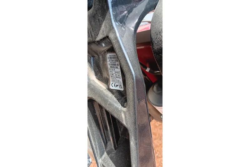 Slide: The Image of 2025 Tracker Pro Team 175 label on metallic surface, showing model and certification details. - 14