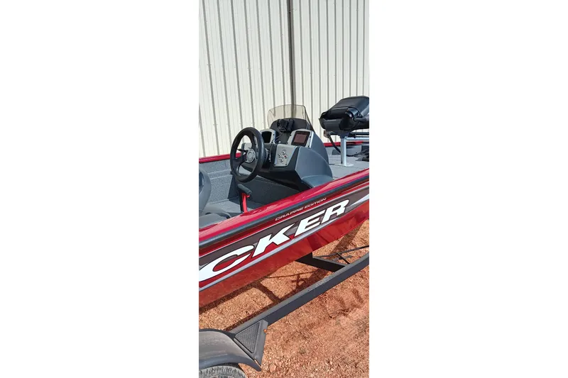 Slide: The Image of 2025 Tracker Pro Team 175 boat interior with steering wheel and seating. - 19