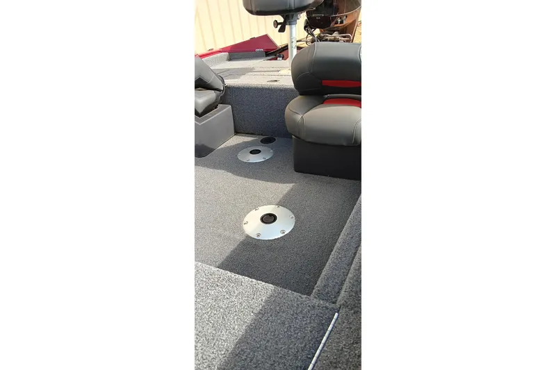 Slide: The Image of 2025 Tracker Pro Team 175 boat interior with gray carpet and seating. - 7