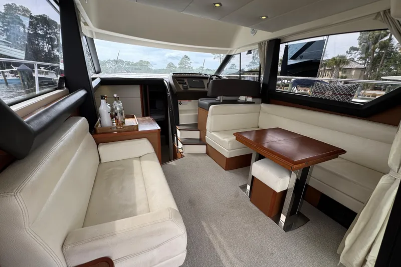 Slide: The Image of Luxurious interior of a 2014 Prestige 400 yacht with elegant seating and wooden table. - 13