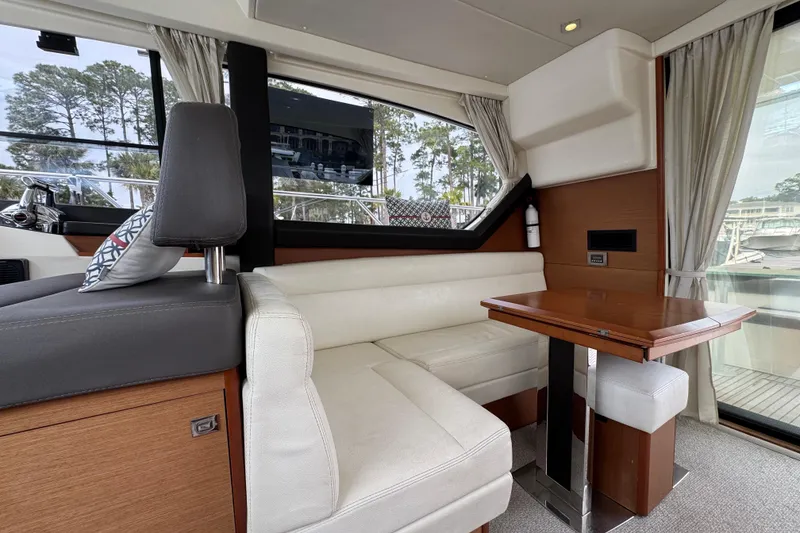 Slide: The Image of Luxurious interior of 2014 Prestige 400 yacht with elegant seating and wooden table. - 14