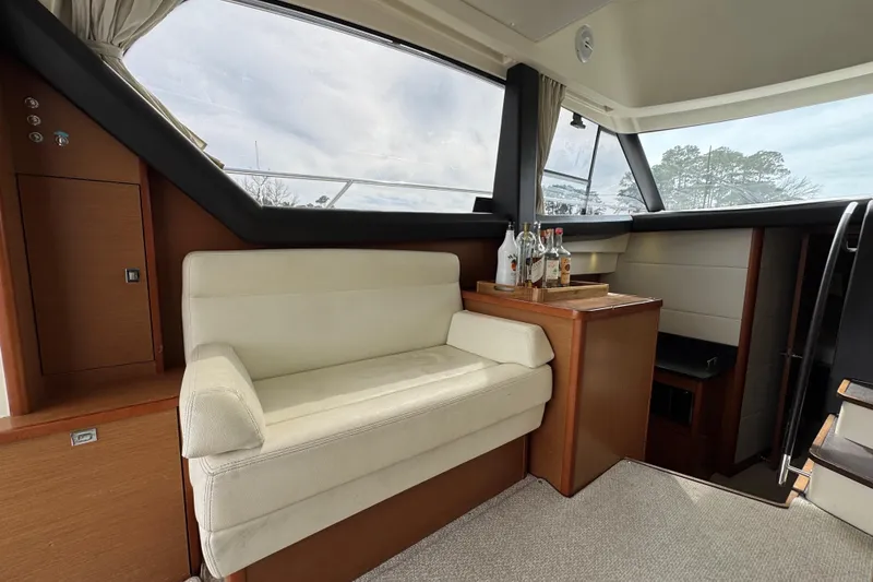 Slide: The Image of Luxurious interior of 2014 Prestige 400 yacht with cream seating and wooden accents. - 15