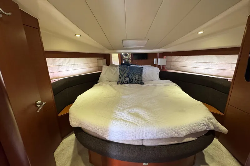 Slide: The Image of Luxurious bedroom interior of 2014 Prestige 400 yacht with cozy bedding and ambient lighting. - 18