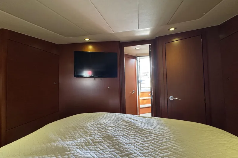 Slide: The Image of Luxurious interior of 2014 Prestige 400 yacht with TV and cozy bedding. - 23