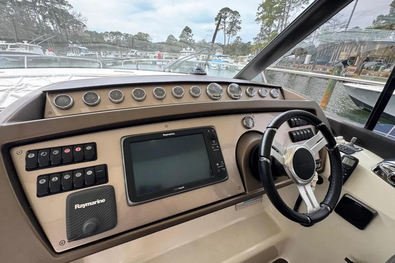 Slide: The Image of Cockpit of 2014 Prestige 400 yacht with steering wheel and navigation controls. - 27