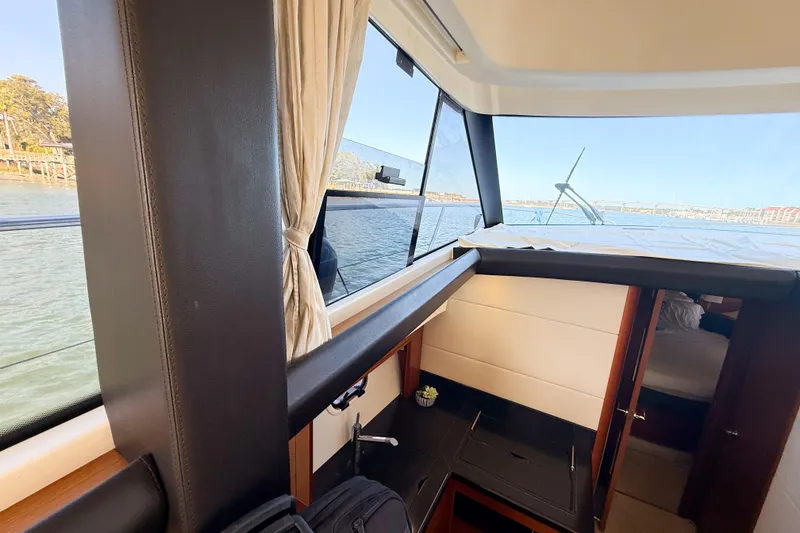 Slide: The Image of Interior view of 2014 Prestige 400 yacht with scenic water backdrop. - 29
