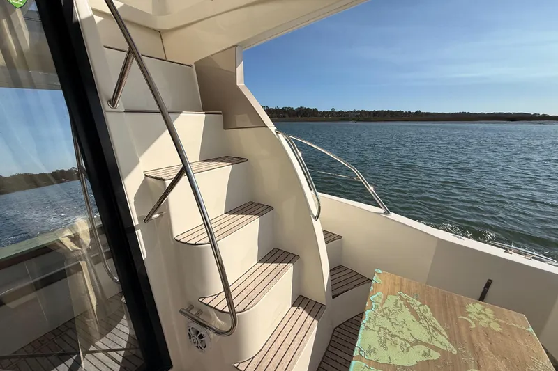 Slide: The Image of Staircase on 2014 Prestige 400 yacht with scenic water view. - 32