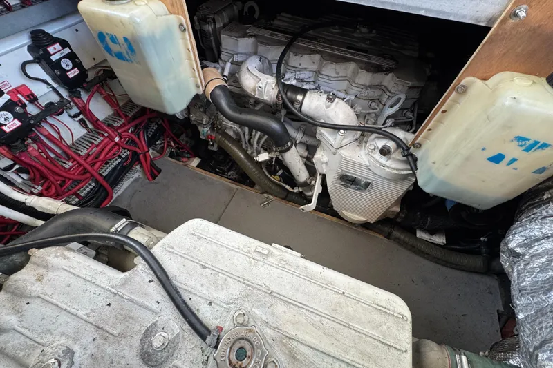 Slide: The Image of Engine compartment of a 2014 Prestige 400 boat, showcasing wiring and components. - 44