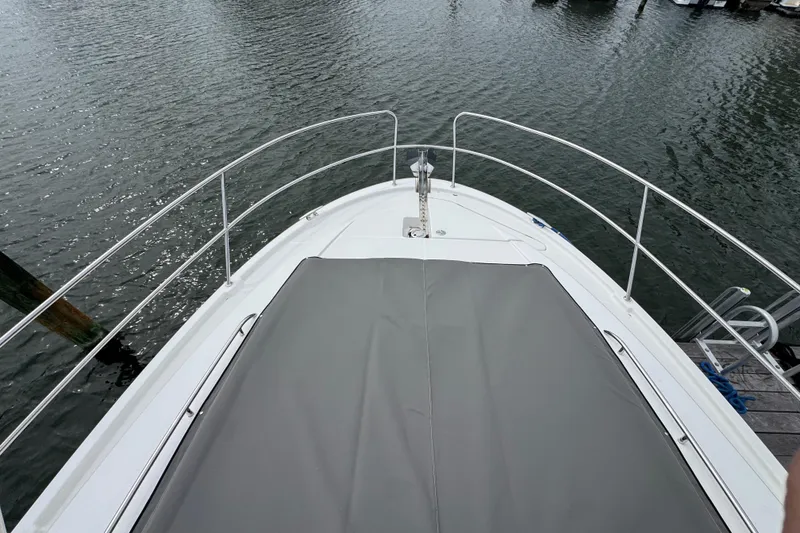 Slide: The Image of Bow view of 2014 Prestige 400 yacht docked on calm water. - 6
